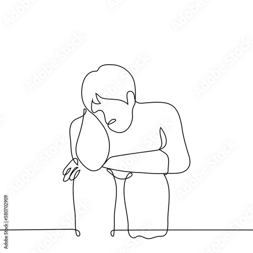 man sitting with his head bowed hugging his knees - one line drawing vector. concept isolation alone, abandoned or depressed