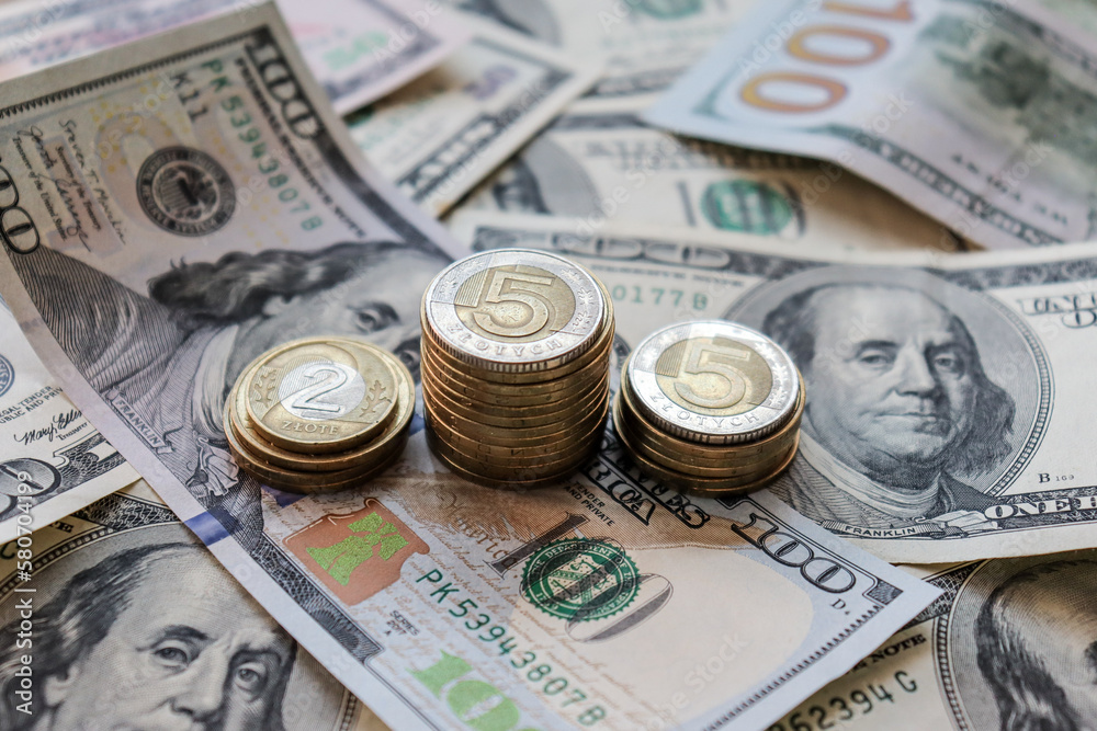 Dollar bills laid out on table. Three different columns of coins, financial crisis, money, finance, savings, salary, bank, Ukrainian money, hryvnia, eurocents, polish zloty. Photo, macro photography Dollar bills laid out on table. Three different columns of coins, financial crisis, money, finance, savings, salary, bank, Ukrainian money, hryvnia, eurocents, polish zloty. Photo, macro photography