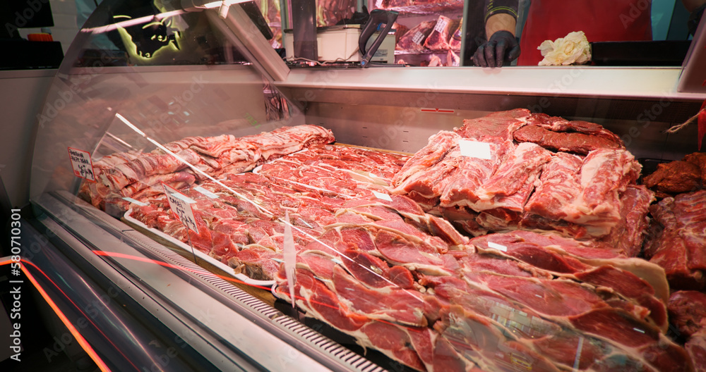 Large amount of lamb meat on display in a butcher shop. Food industry concept.