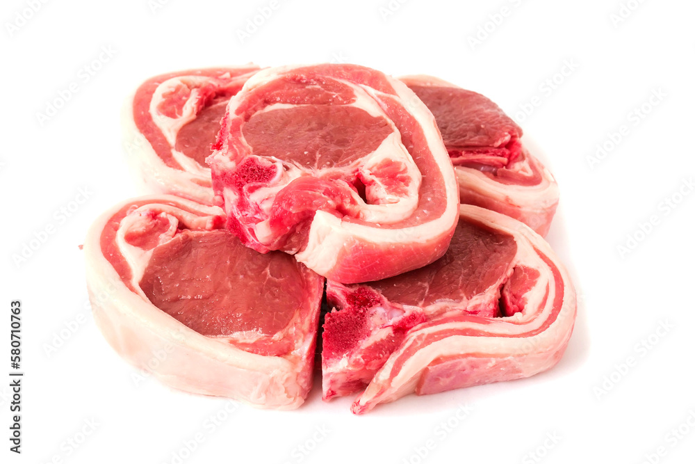 Four raw lamb chops on white background. Meat product of high quality and value. Food supply business.