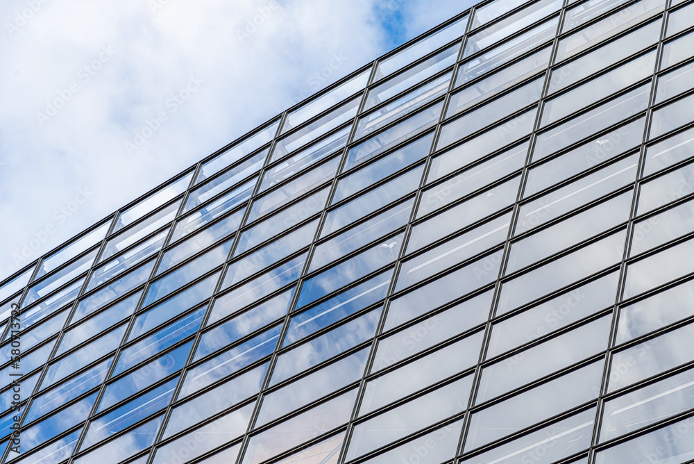 The wall of glass windows of a building.