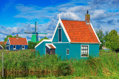 Obraz na płótnie Panorama of traditional dutch houses at the Zaan river in Zaandijk, Netherlands. w salonie