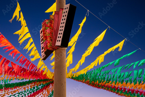 decoração de são joão - sanfona decorativa e bandeiras coloridas  de festa junina no brasil photo
