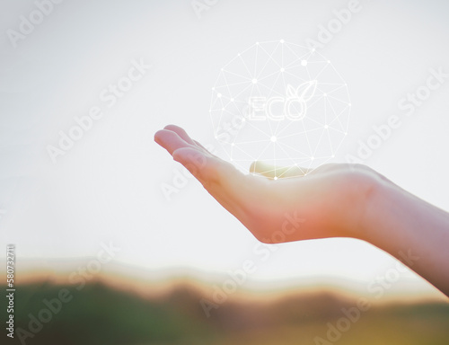 female hand with sun rays, with ESG icon concept. The environment is of a business connection and sustainable development. renewable energy is environmentally friendly. Technology and new forward.