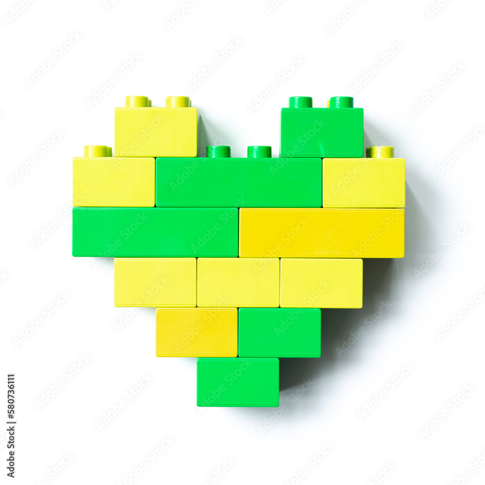 Two colors heart from blocks isolated on white background, top view object, design element, green yellow figure heart from child blocks. Love concept, Valentines card, Toys, games Two colors heart from blocks isolated on white background, top view object, design element, green yellow figure heart from child blocks. Love concept, Valentines card, Toys, games