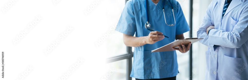 Medical team sitting and discussing at table.
