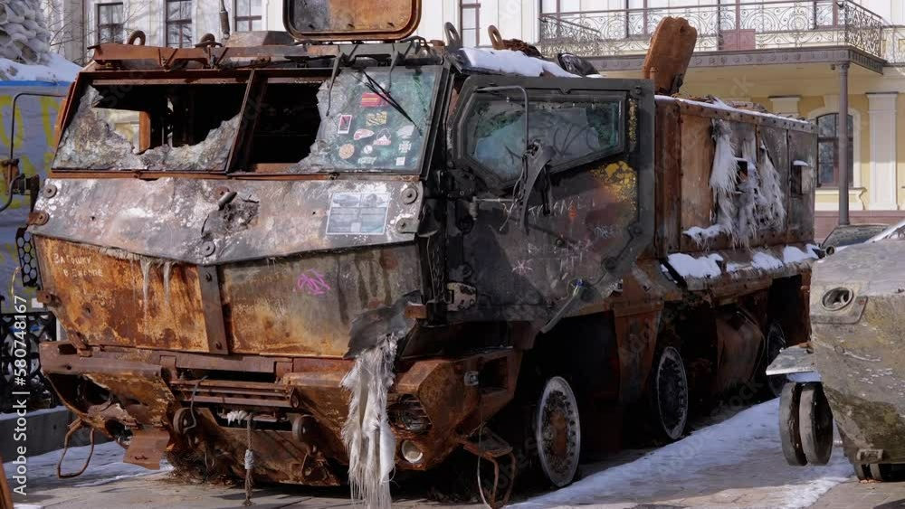 UKRAINE, KYIV, FEBRUARY 2022: Demonstration of a Destroyed, Burnt, Rusty Russian Military Vehicle in Kyiv. Burnt Military armored personnel carrier on Square of Sofia. Russian invasion of Ukraine. UKRAINE, KYIV, FEBRUARY 2022: Demonstration of a Destroyed, Burnt, Rusty Russian Military Vehicle in Kyiv. Burnt Military armored personnel carrier on Square of Sofia. Russian invasion of Ukraine.