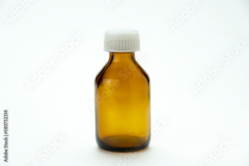 Medical bottle for medication with a white cap isolated on a white background.