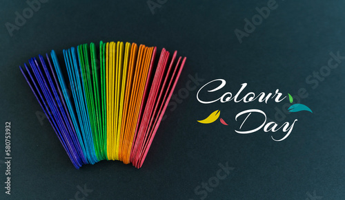 International Colour day background design, Colourful Stick isolated on black background  photo