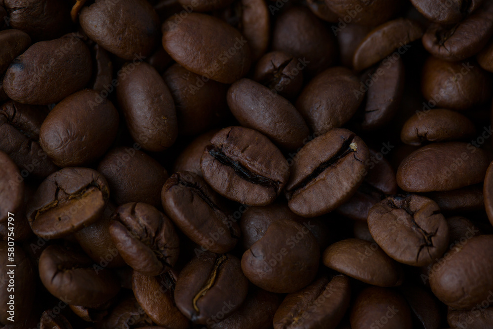 Naklejka premium Roasted coffee beans background abstract