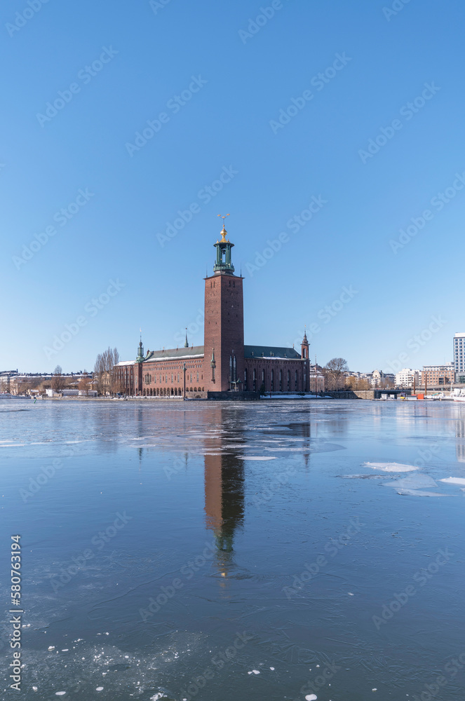 The Town City Hall at the icy frozen bay Riddarfjärden down town Stockholm, a snowy sunny spring day in Stockholm