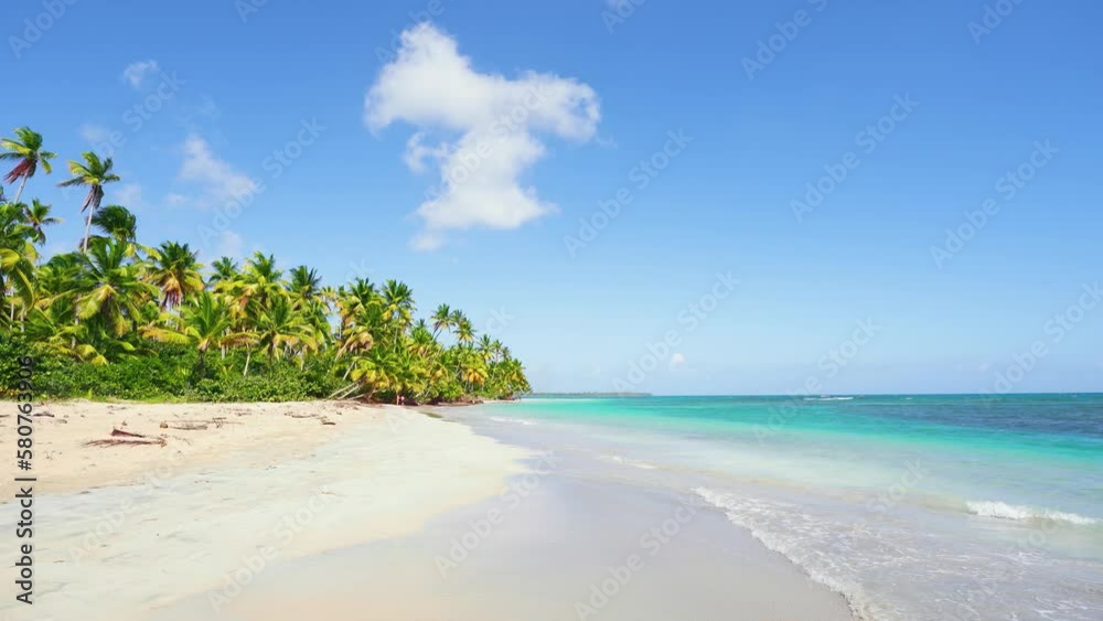 Paradise sunny beach with coconut palms on a sandy beach and blue sea. Popular tourist destination in summer. Beautiful white beaches of Mauritius island. Summer travel concept. Rest on the sea. Paradise sunny beach with coconut palms on a sandy beach and blue sea. Popular tourist destination in summer. Beautiful white beaches of Mauritius island. Summer travel concept. Rest on the sea.
