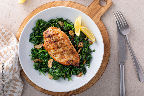 Quadro em tela Grilled chicken with sauteed spinach, healthy dinner idea