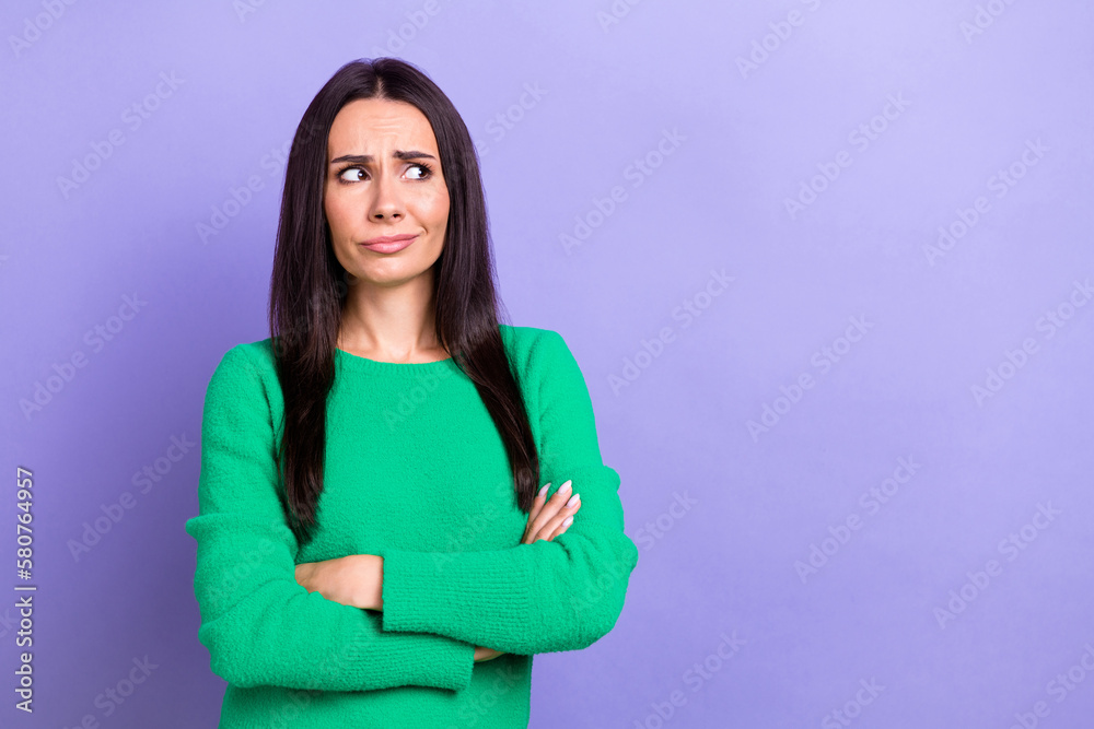 Photo portrait of young unhappy suspicious lady wear green sweater crossed hands looking empty space dislike info isolated on violet color background - obrazy, fototapety, plakaty 