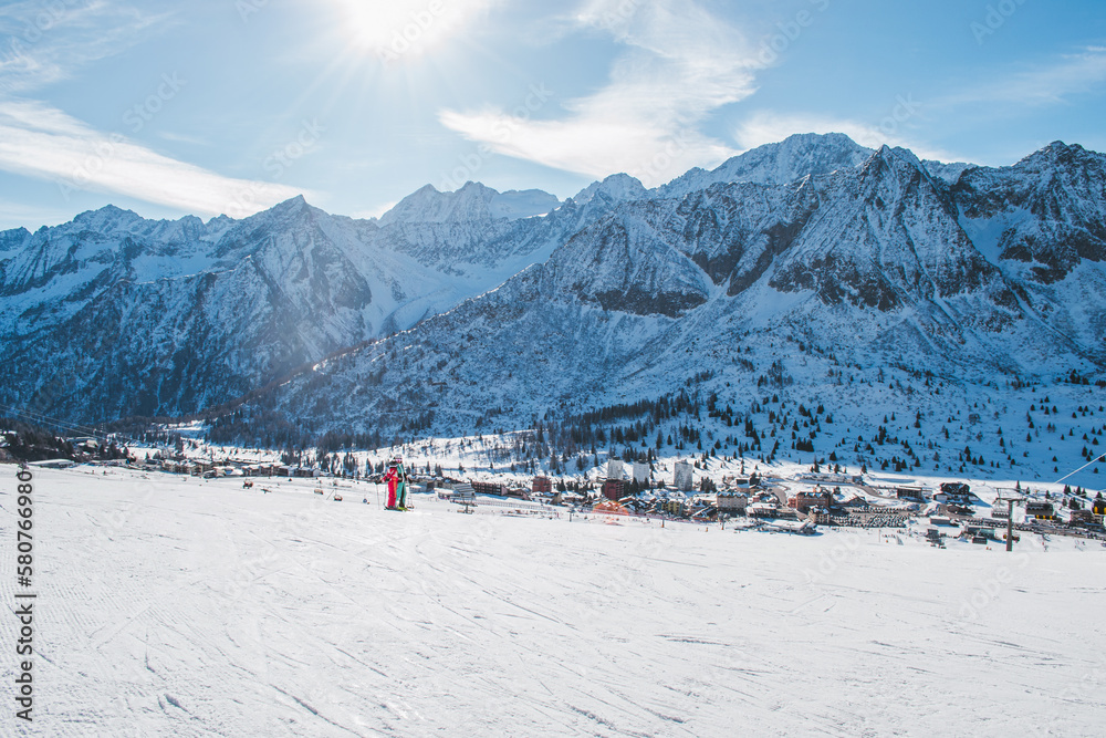 A beautiful scenery of the italian Alps with the city Ponte di Legno in the background. A beautiful scenery of the italian Alps with the city Ponte di Legno in the background.