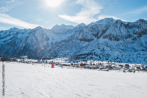 A beautiful scenery of the italian Alps with the city Ponte di Legno in the background.