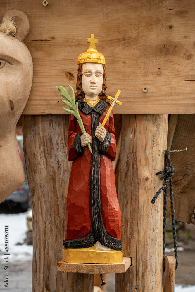 Obraz premium Beautiful wooden handmade statue of Saint Casimir's, in Kaziuko Muge, a spring annual folk arts and crafts fair in Vilnius, Lithuania, Europe, vertical
