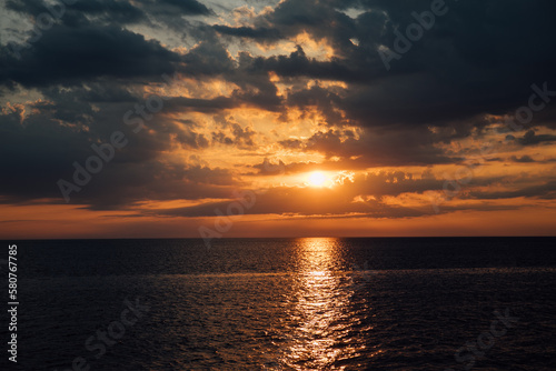 Fototapeta Naklejka Na Ścianę i Meble -  sea at sunset sky in clouds nature boat trip