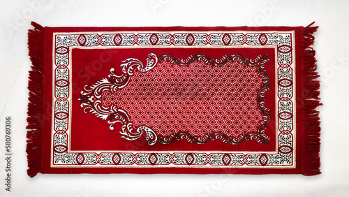 Decorative colorful prayer rug on white background