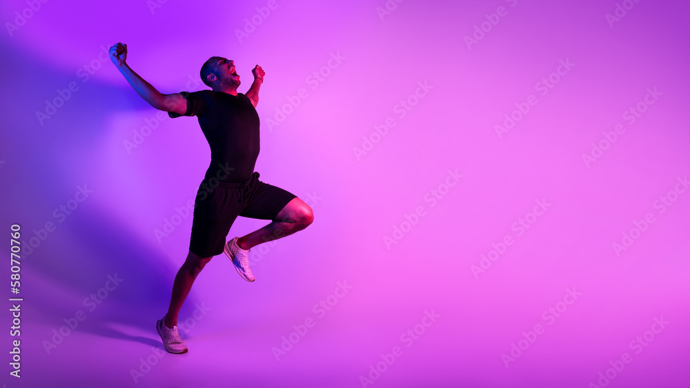 Black Athlete Man Running Celebrating Victory Shouting Over Purple Background