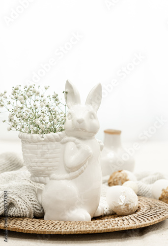 Easter composition with a ceramic hare and eggs.