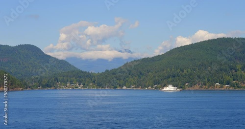 Wallpaper Mural Establishing shot of ocean and islands with ferry on horizon and mountains in beautiful British Columbia. Canada. Slow motion. Day time on February 2023. Still camera. ProRes 422 HQ. Torontodigital.ca