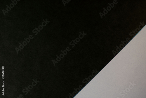 Abstract color background made of sheets of black and gray paper