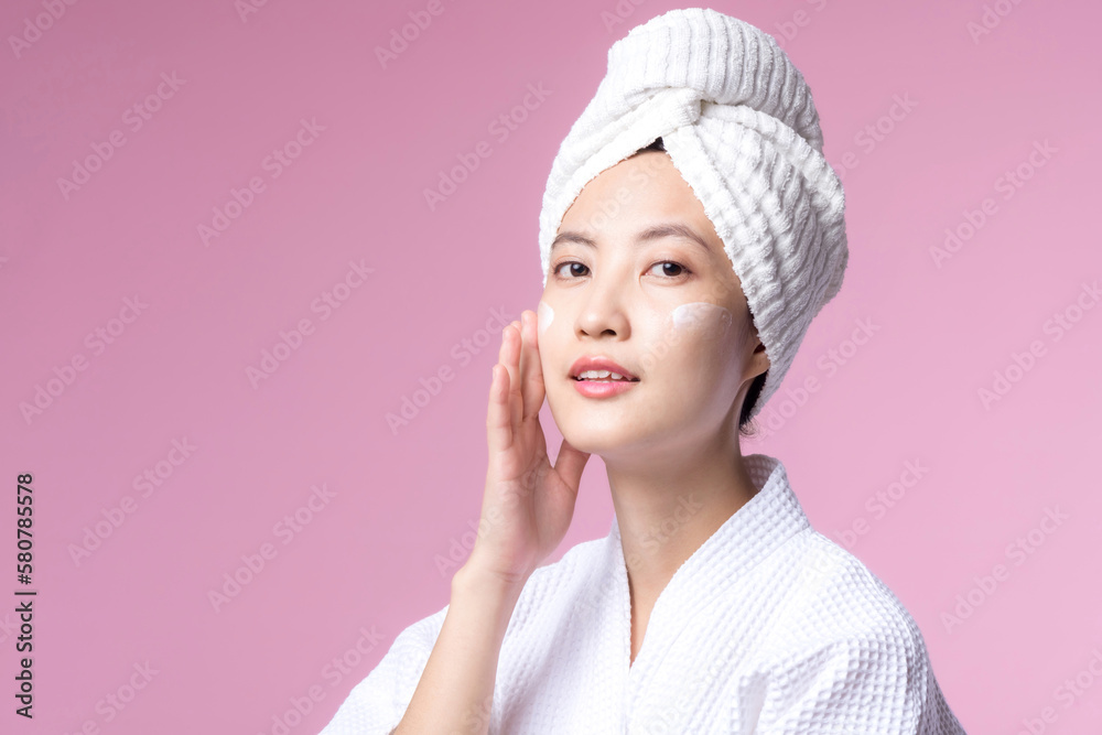 Young asian woman applying facial skincare face cream, cosmetic moisturiser on healthy natural skin make up face. Portrait glowing smile girl person model with care beauty product, spa, cosmetology. Young asian woman applying facial skincare face cream, cosmetic moisturiser on healthy natural skin make up face. Portrait glowing smile girl person model with care beauty product, spa, cosmetology.