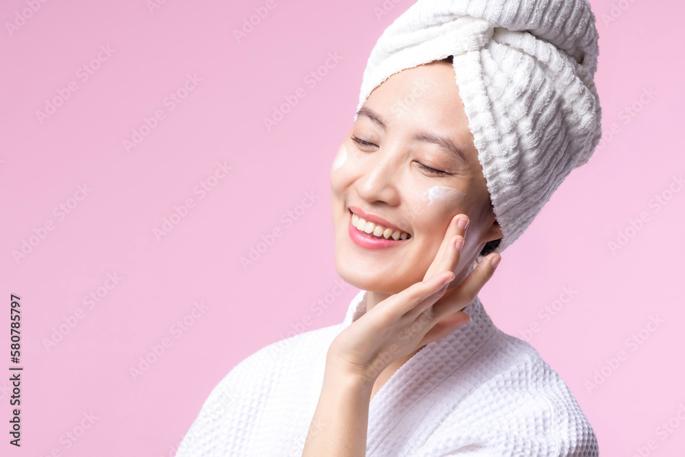 Young asian woman applying facial skincare face cream, cosmetic moisturiser on healthy natural skin make up face. Portrait glowing smile girl person model with care beauty product, spa, cosmetology. Young asian woman applying facial skincare face cream, cosmetic moisturiser on healthy natural skin make up face. Portrait glowing smile girl person model with care beauty product, spa, cosmetology.