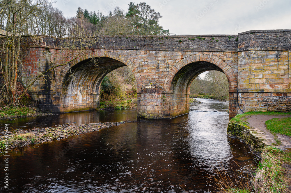River Derwent flows below Blanchland Bridge, formed by the meeting of two burns in the North Pennines and flows between the boundaries of Durham and Northumberland as a tributary to the River Tyne