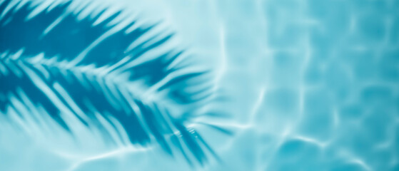 Aqua waves and coconut palm shadow on blue background. Water pool texture top view.Tropical summer mockup design. Luxury travel holiday.