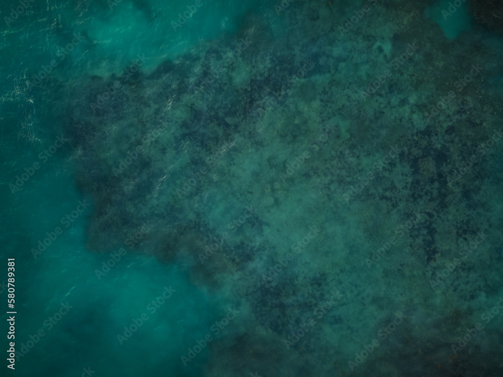 Sea water surface. View from above. Bright colors. Minimalism. Abstraction. There are no people in the photo. Water sports, fishing, swimming, bathing.