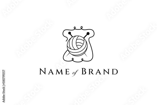Line art logo of a girls outfit with wool balls and knitting needles.