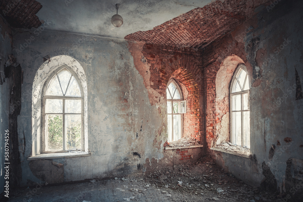 Abandoned interior with stained glass windows and shabby walls
