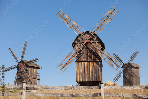 3 old windmills in the field