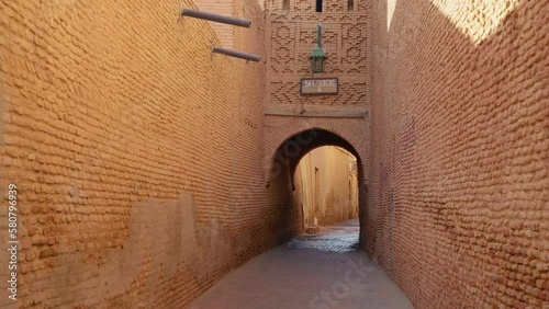 Medina of Tozeur the old city pathway trough the arch. Travelling to North Africa to the brick city. Place of historic interest. photo