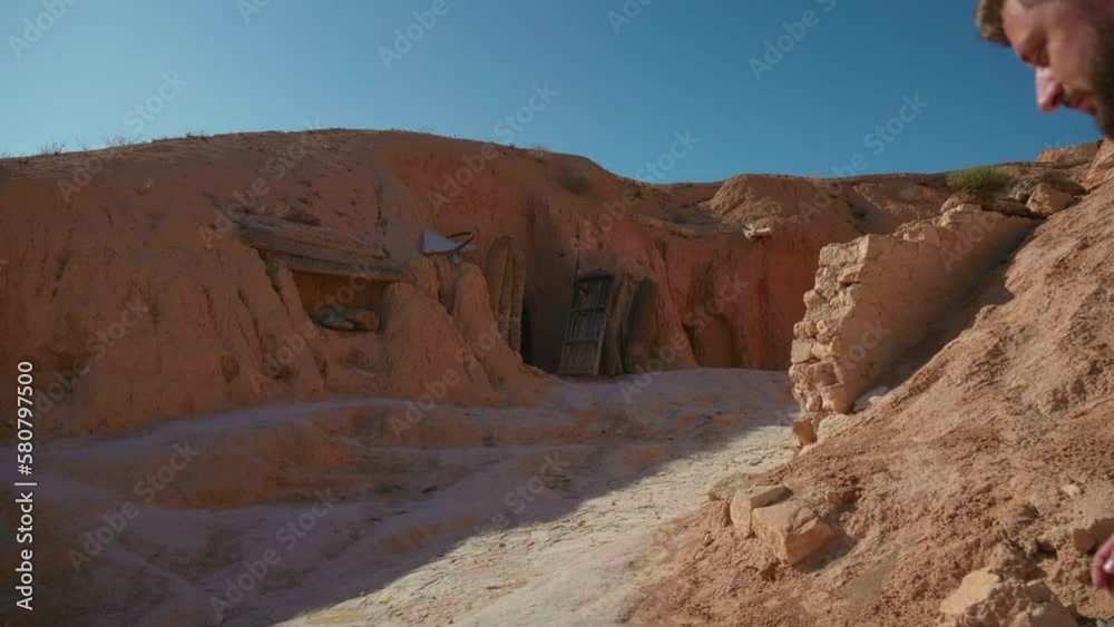 In the yard of inhabitants settlement in old Matmata. Underground houses of old natives in North Africa visited by tourists. In the yard of inhabitants settlement in old Matmata. Underground houses of old natives in North Africa visited by tourists.