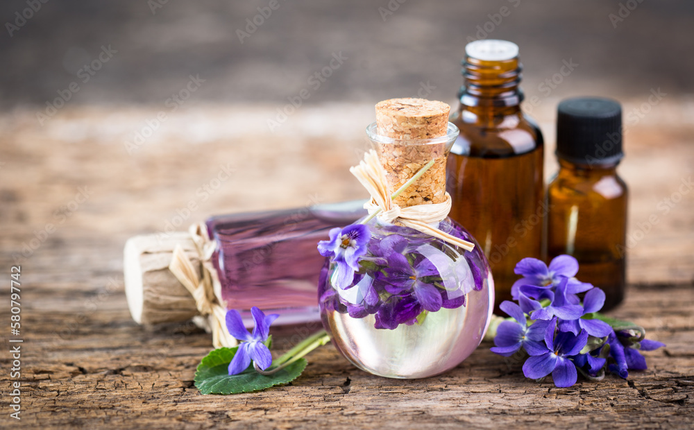 Violet essential oil in the bottle Stock Photo