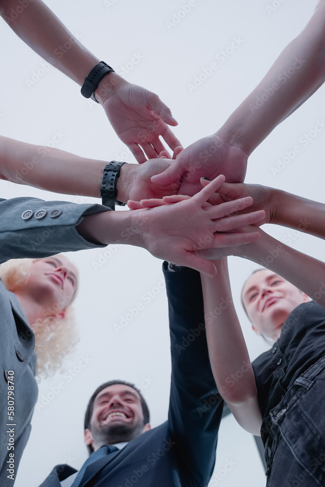 business people making pile of hands. People with joined hands as a team. Stack of hands. Unity and teamwork concept. business people making pile of hands. People with joined hands as a team. Stack of hands. Unity and teamwork concept.