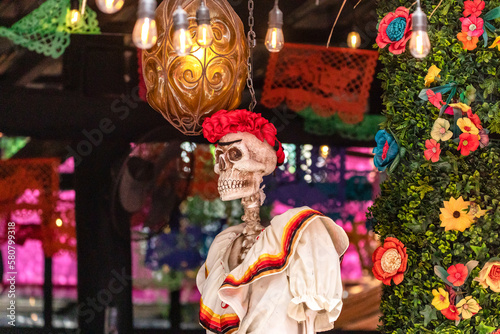 Female folk saint revered mostly in Mexico celebrates the day of the dead along with the Mexican flag and many flags, this is an ideal place to enjoy a Mexican celebration.