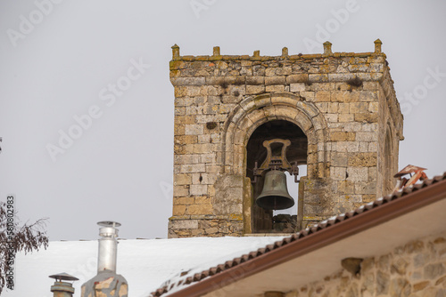 Bell tower of a Romanesque church, in the snow