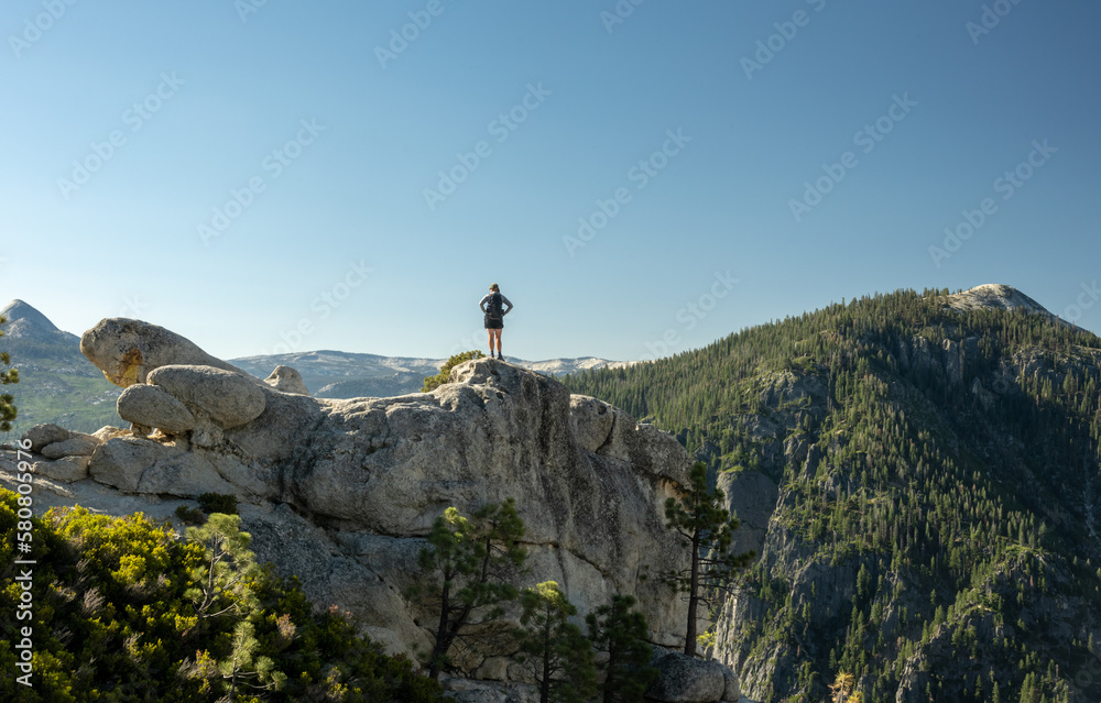 Woman Stands on Rocks at Yosemite Point