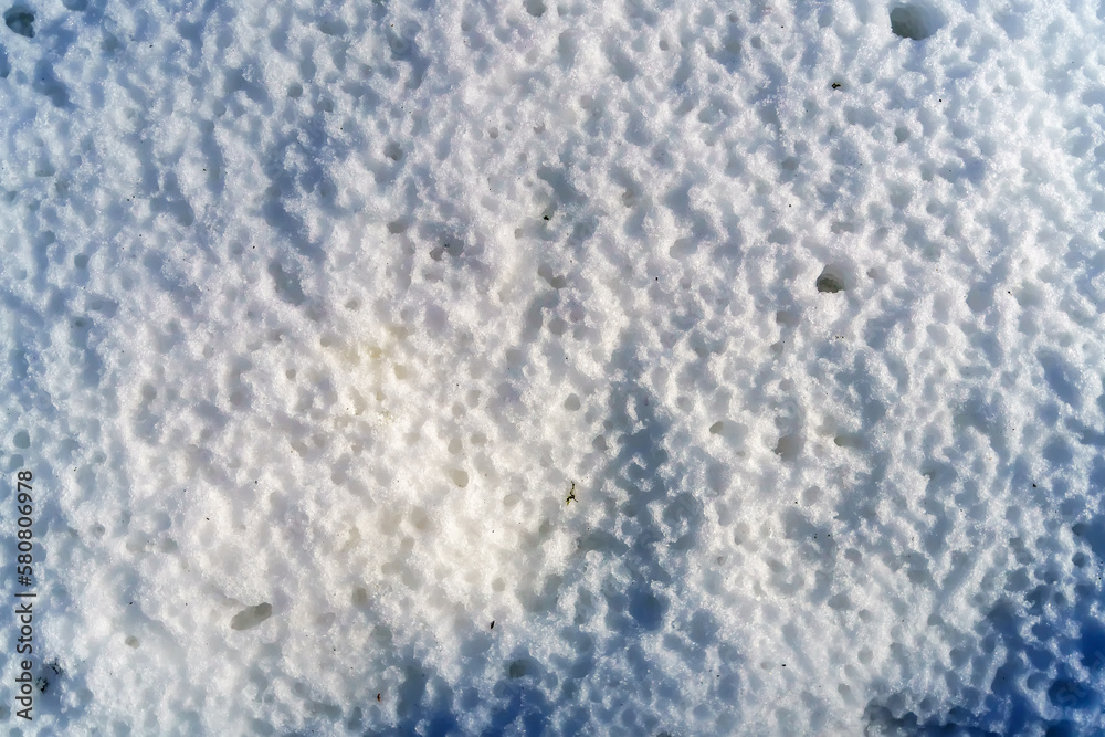 Texture melted snow after rain with holes from spring drops Texture melted snow after rain with holes from spring drops
