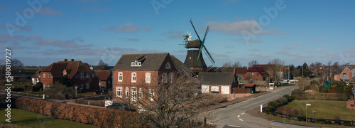 Panoramablick auf den Ort Süderhafen mit Mühle.,  Nordstrand,  Nordfriesland, Nordsee, Schleswig-Holstein photo
