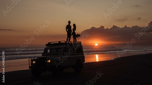 Romantic couple at Pasut Beach Sunset in Bali, Indonesia
