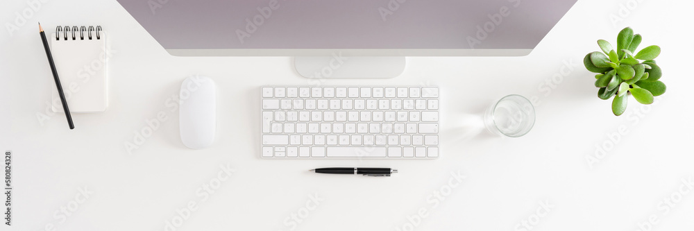 Overhead shot of office desktop with computer Overhead shot of office desktop with computer
