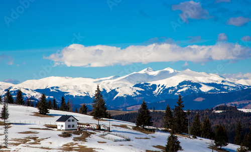 A beautiful landscape of the Carpathian mountains with the peaks covered with snow