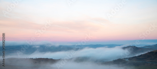 Fog in the valleys between the hills in the morning