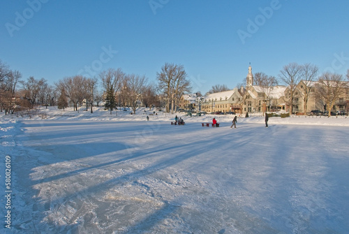 Kids skating on frozen pond in Terrebonne on a sunny day.