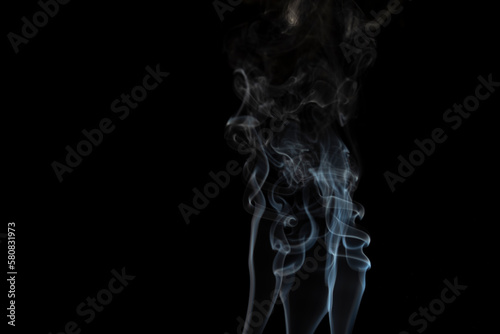 Fototapeta Naklejka Na Ścianę i Meble -  incense stick with smoke against black background